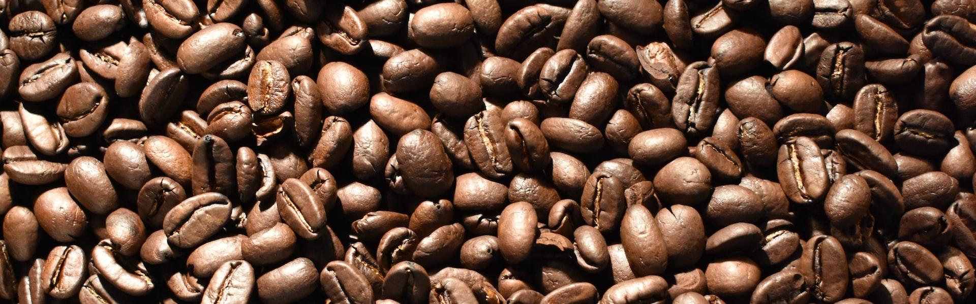 a pile of coffee beans is shown in this image