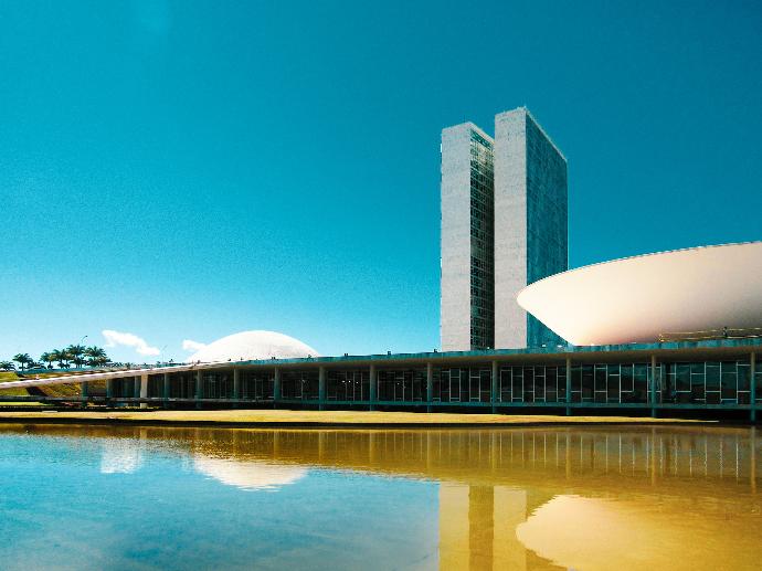 white concrete building near body of water during daytime